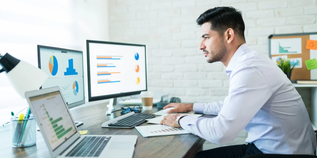 Man working on computer showing Digital Literacy and Technology Skill Sets